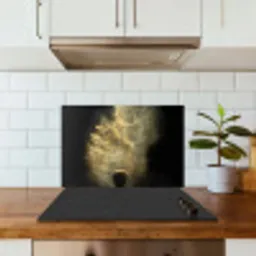 Goud poeder op een zwarte achtergrond keuken achterwand spatscherm klein -sfeer2