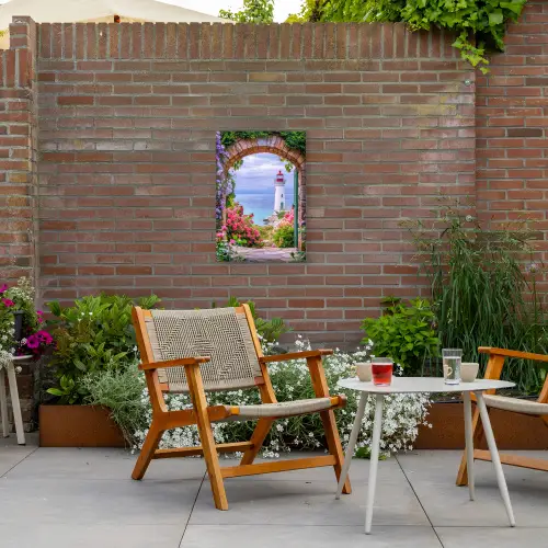 Doorkijk - Vuurtoren - Bloemen - Uitzicht Tuinposter op houten frame 2 cm dik klein -sfeer3