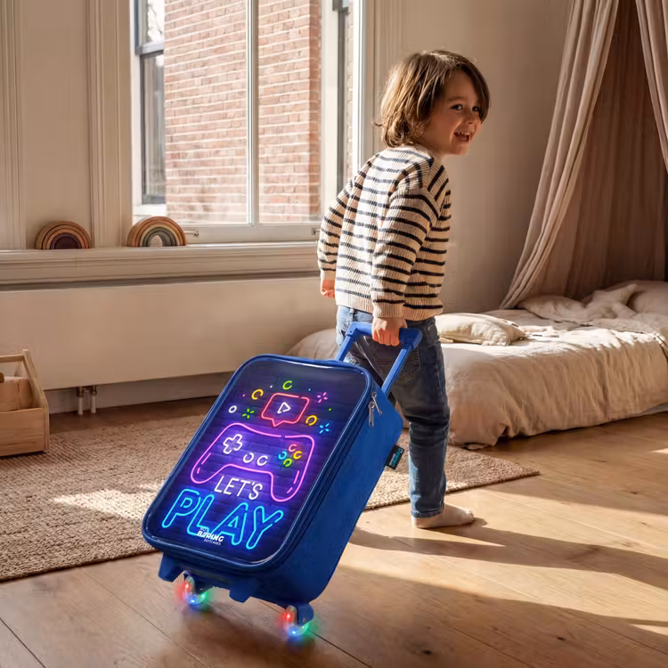 Kids’ Suitcase - Blue - Neon controller against a brick wall — 5
